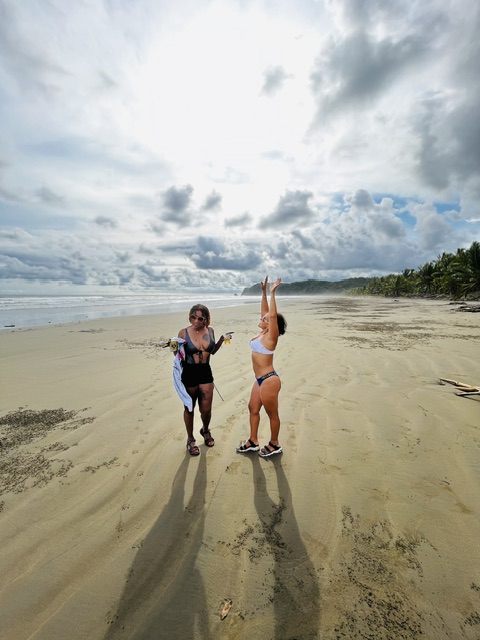 Friends cheers-ing on an empty Costa Rica beach