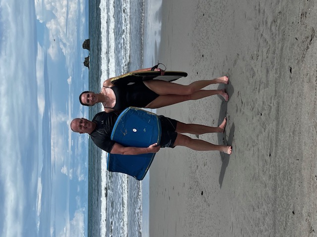 Couple with bodyboards on a Costa Rica beach