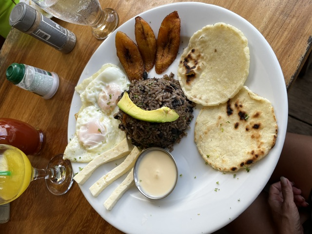 Traditional Costa Rican gallo pinto breakfast with eggs, plantains and tortillas