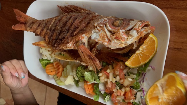 Whole fried red snapper with fresh veggies and pico de gallo